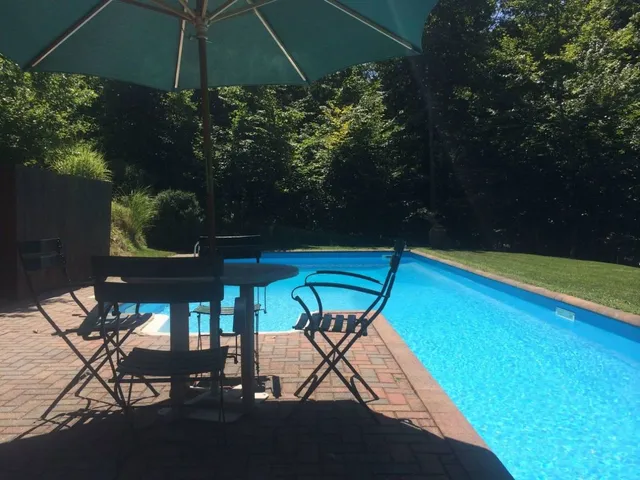 a view of a swimming pool with a patio