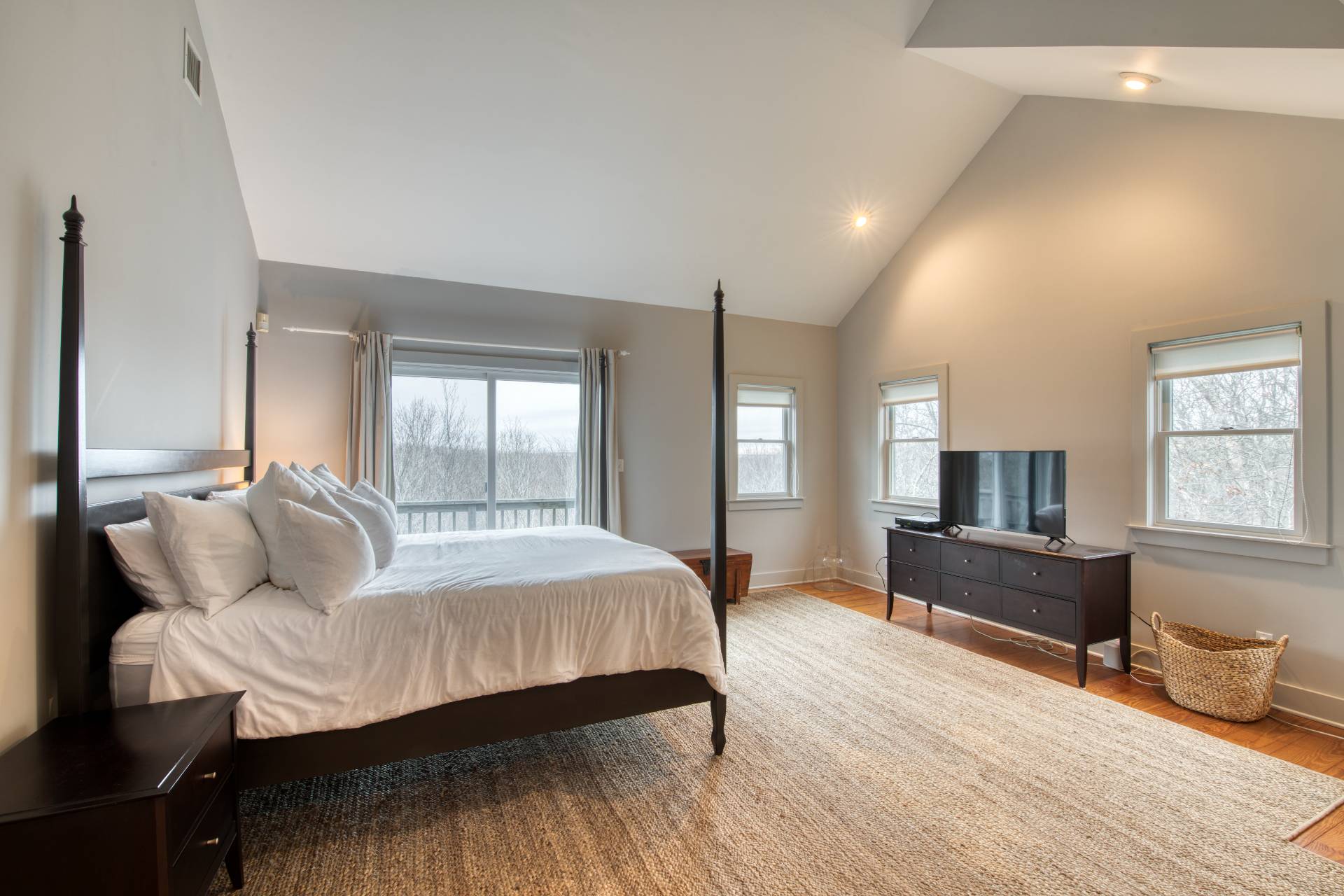 25 Laurel Hill Lane Amagansett, NY 11930 - Photo 6 of 13 a bedroom with a bed and wooden floor