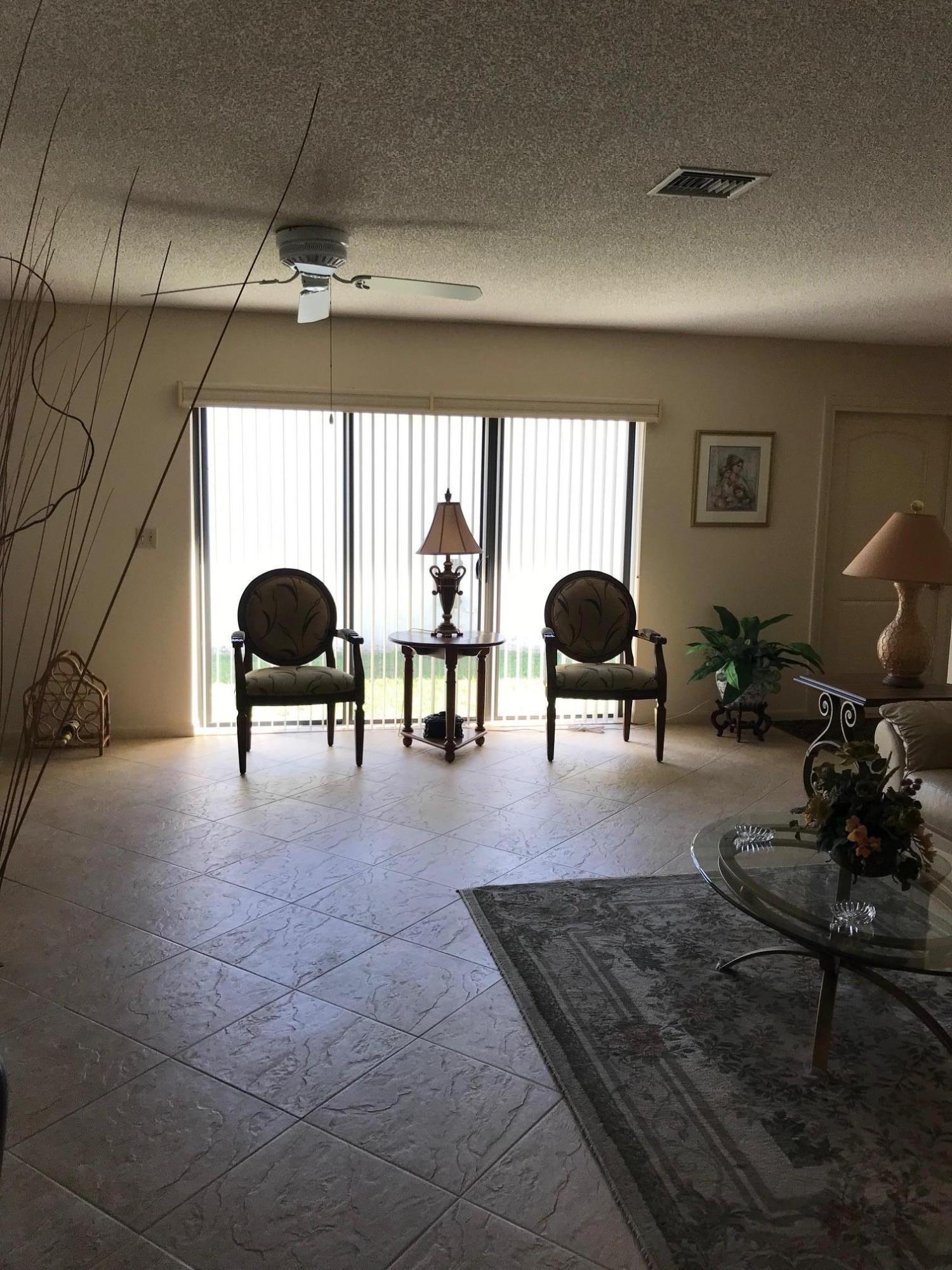 5173 Minto Road Boynton Beach, FL 33472 - Photo 3 of 19 a living room with furniture rug and a window