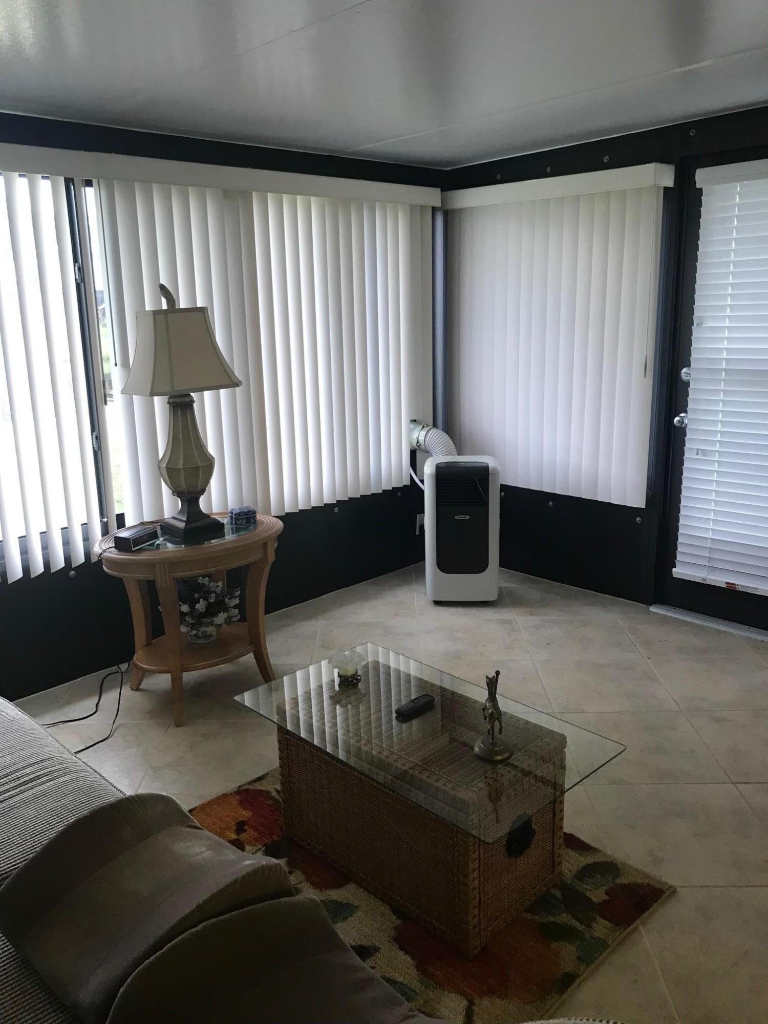 5173 Minto Road Boynton Beach, FL 33472 - Photo 7 of 19 a living room with furniture and a flat screen tv
