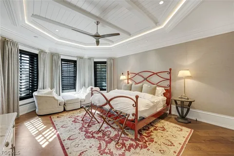 a bedroom with a large bed and a large window