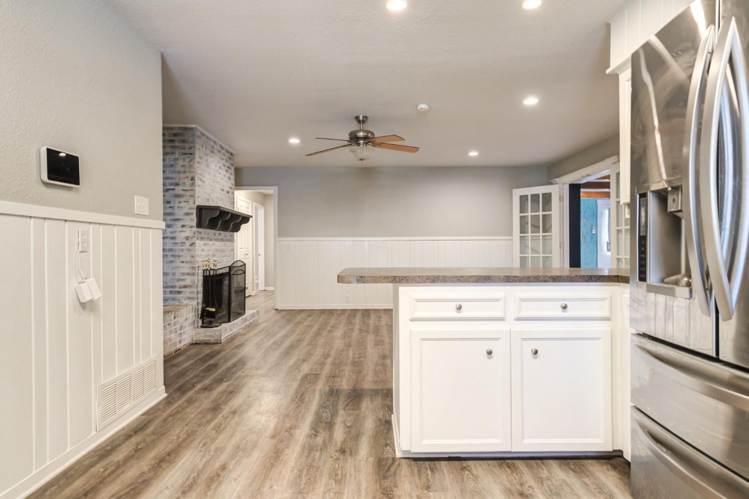 4409 49th Street Lubbock, TX 79414 - Photo 15 of 49 a kitchen with stainless steel appliances granite countertop a refrigerator and a stove top oven