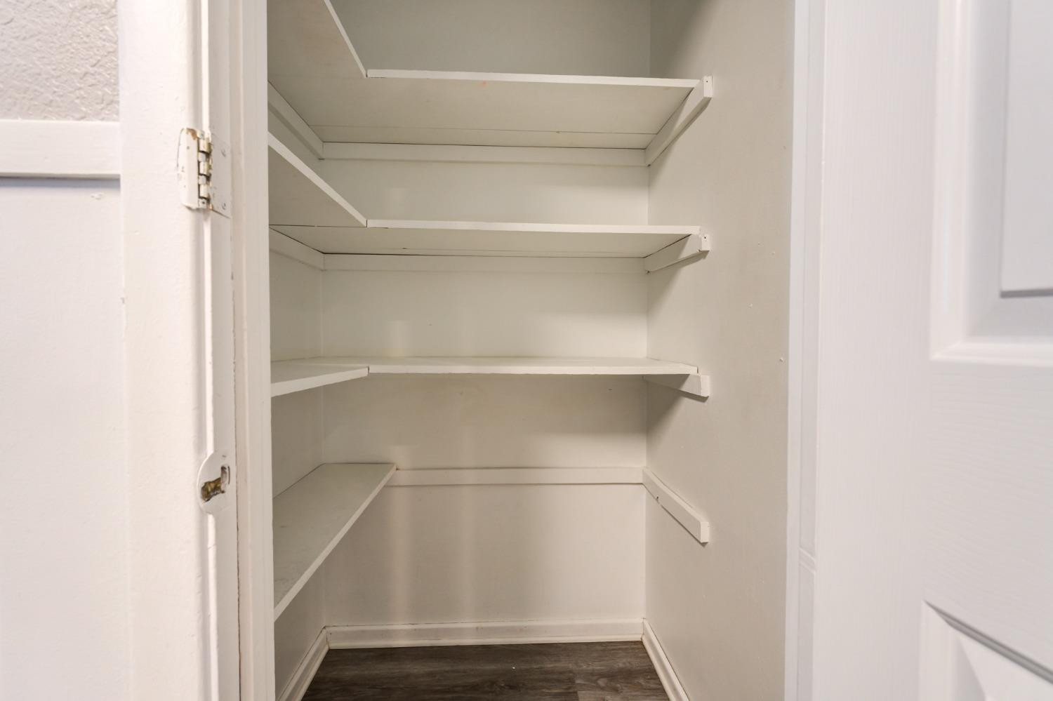 4409 49th Street Lubbock, TX 79414 - Photo 16 of 49 a view of walk in closet with empty racks
