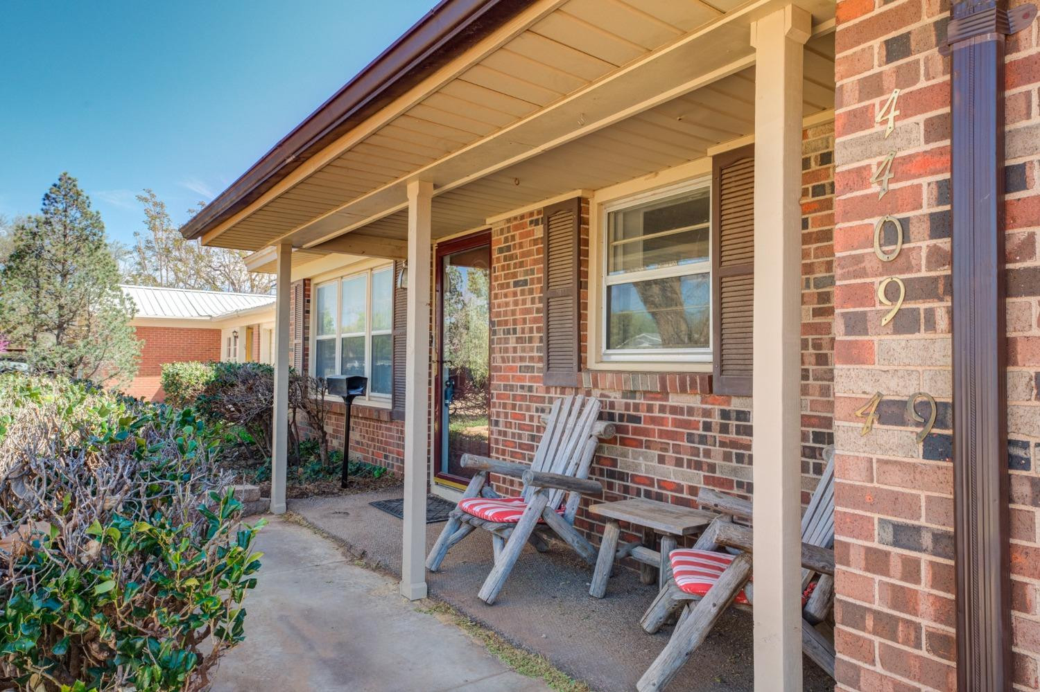 4409 49th Street Lubbock, TX 79414 - Photo 2 of 49 a front view of a house with outdoor seating