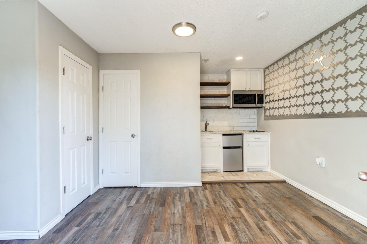 4409 49th Street Lubbock, TX 79414 - Photo 44 of 49 a view of a kitchen with a sink and a stove top oven