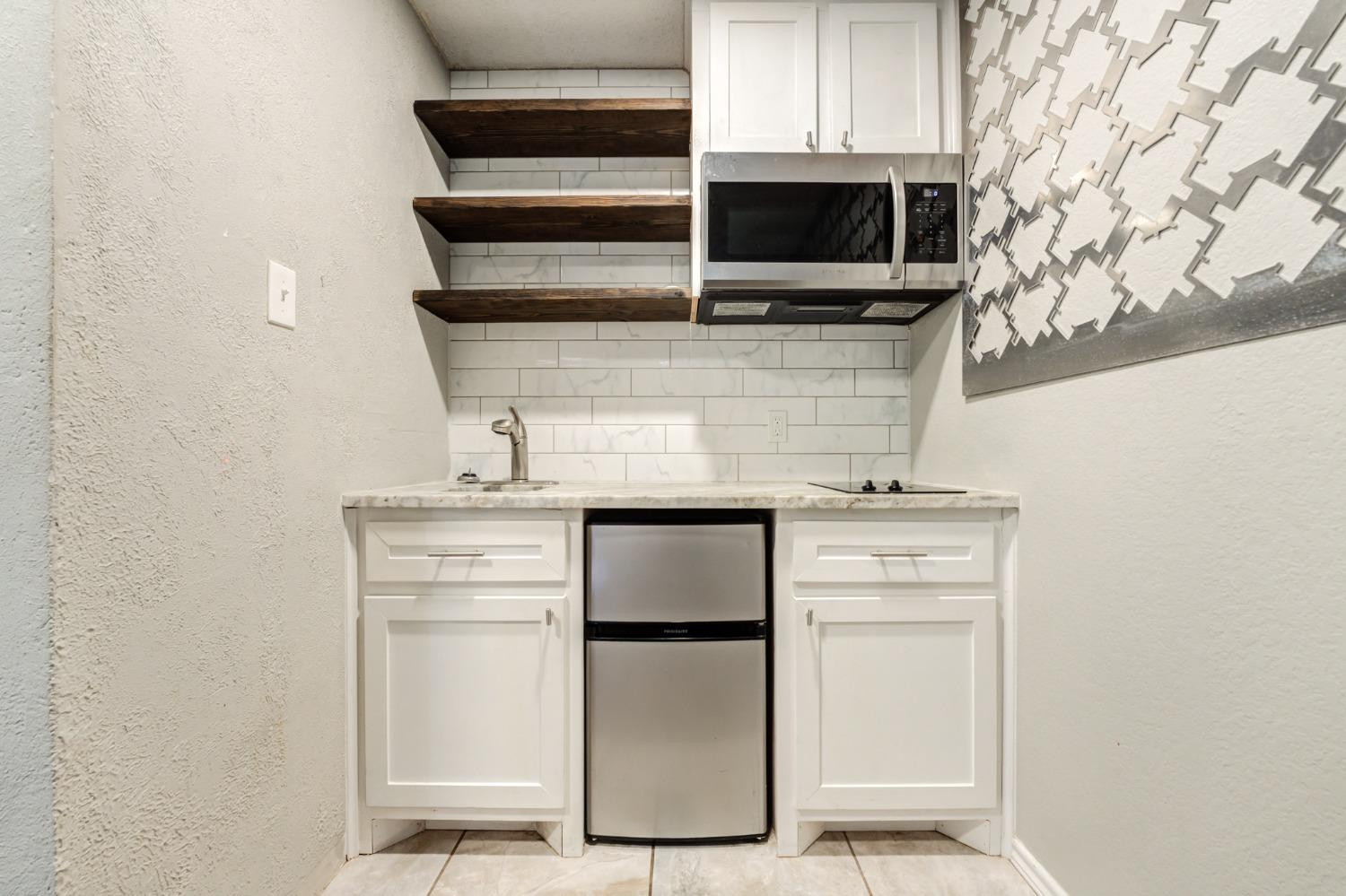 4409 49th Street Lubbock, TX 79414 - Photo 47 of 49 a utility room with washer and dryer