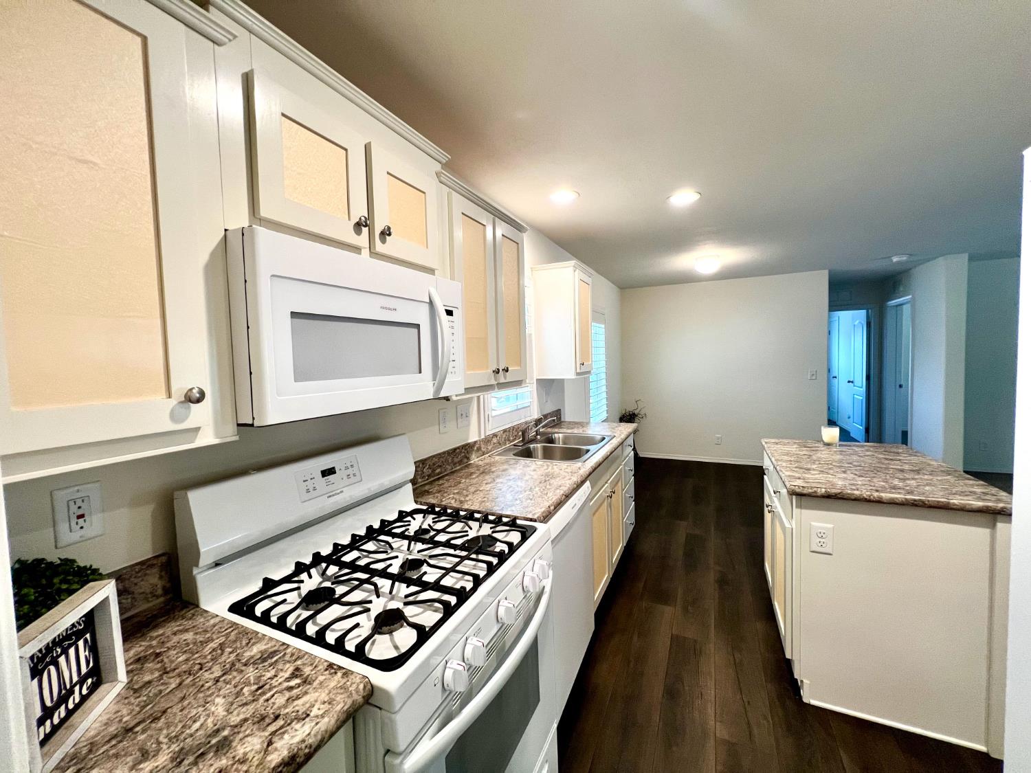 53 Saxton Circle, Unit 53 Citrus Heights, CA 95621 - Photo 8 of 19 a kitchen with stainless steel appliances granite countertop a stove a sink and a microwave