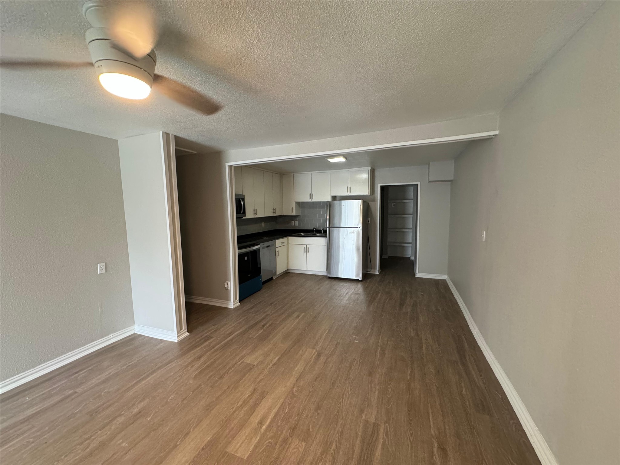 101 South Lockhart Street, Unit A Manor, TX 78653 - Photo 6 of 21 a view of empty room with wooden floor