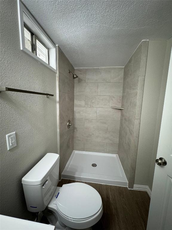 101 South Lockhart Street, Unit A Manor, TX 78653 - Photo 10 of 21 a bathroom with a toilet and a shower