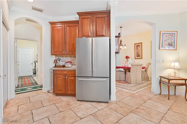 a kitchen with stainless steel appliances a refrigerator and a stove