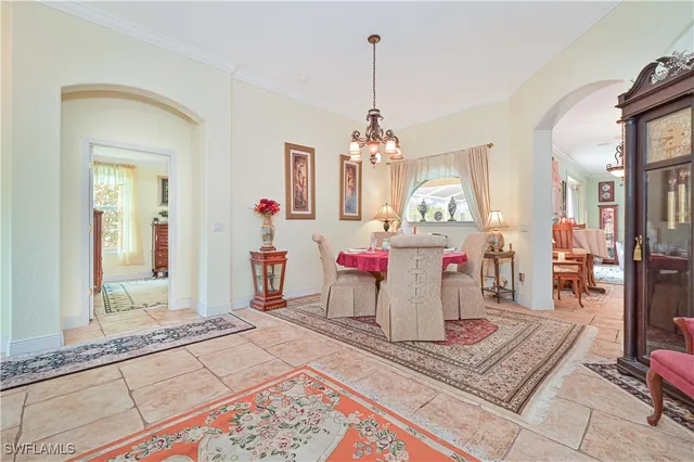a view of a hallway with mirror and furniture