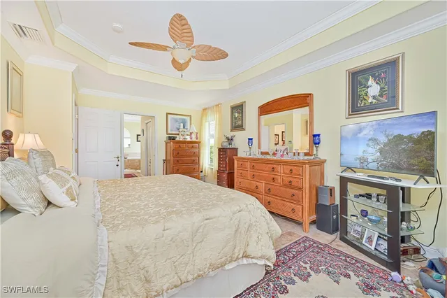 a bed room with a bed and a chandelier