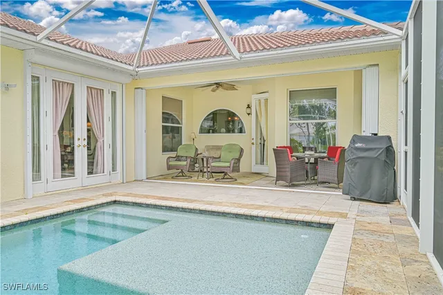 a view of a swimming pool with a lounge chairs