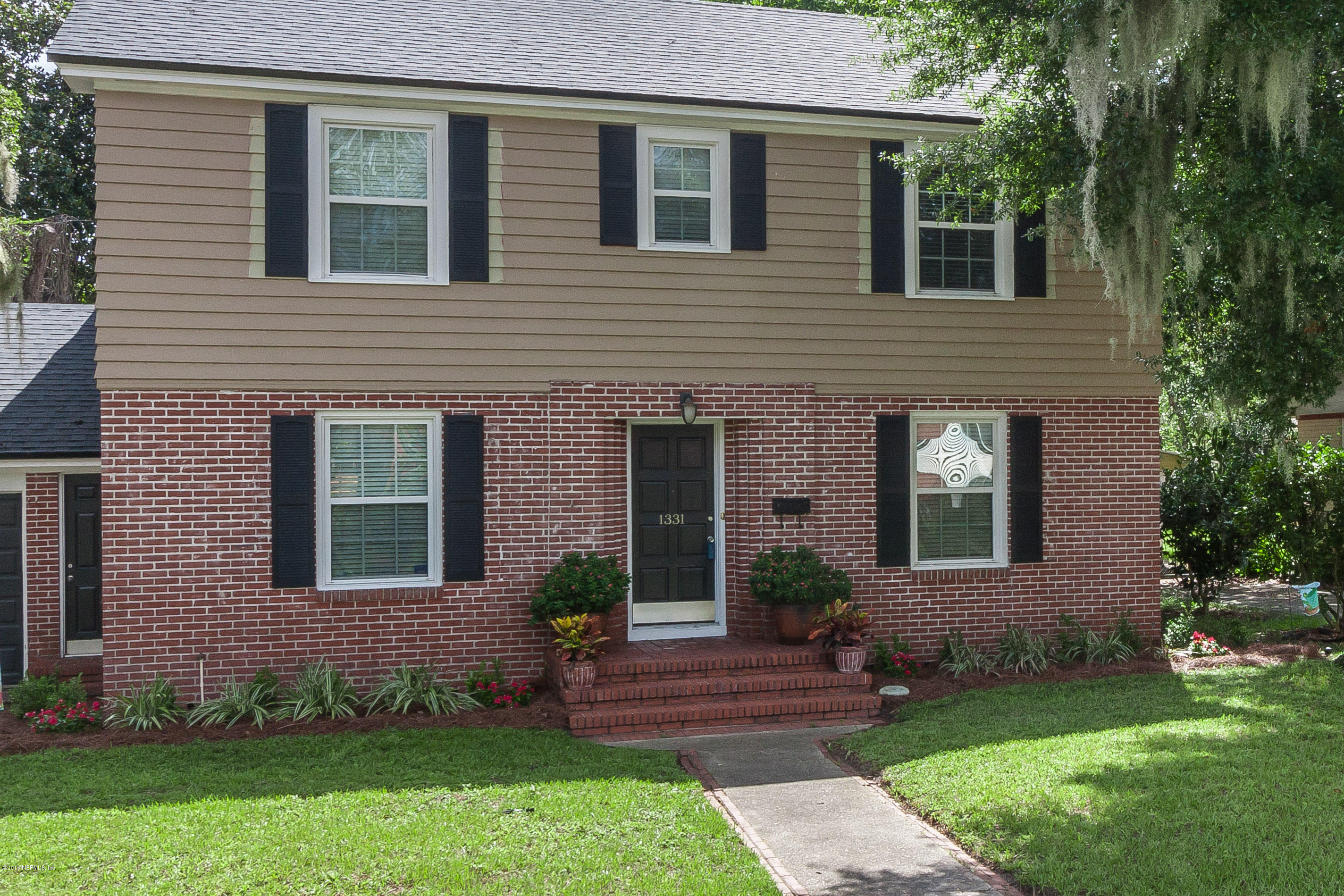 1331 Nicholson Road Jacksonville, FL 32207 - Photo 2 of 30 a front view of a house with garden