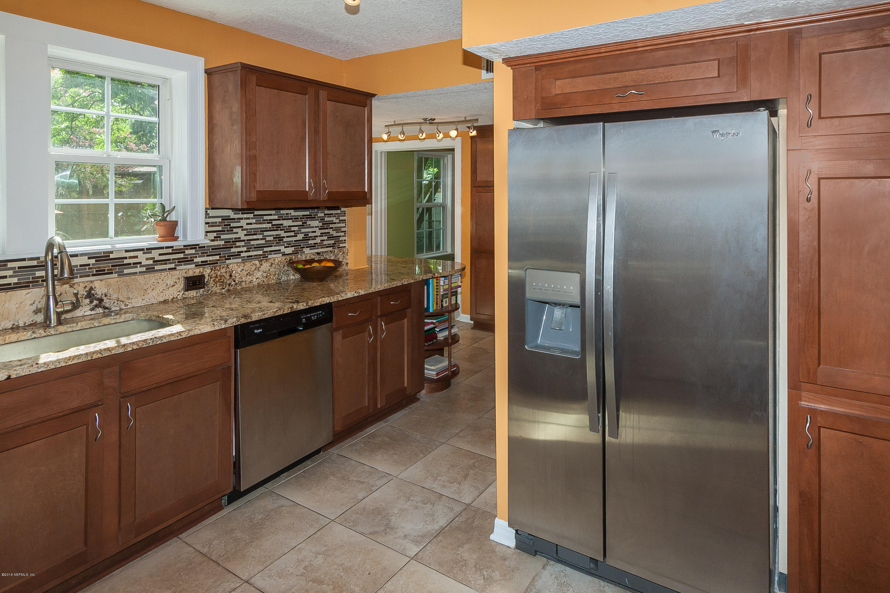 1331 Nicholson Road Jacksonville, FL 32207 - Photo 8 of 30 a kitchen with a refrigerator and a sink