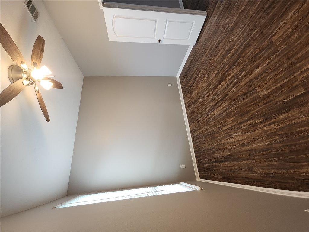 4015 Dunlap Loop College Station, TX 77845 - Photo 12 of 40 wooden floor in an empty room with a window