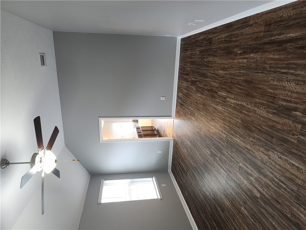 4015 Dunlap Loop College Station, TX 77845 - Photo 14 of 40 wooden floor in an empty room with a window