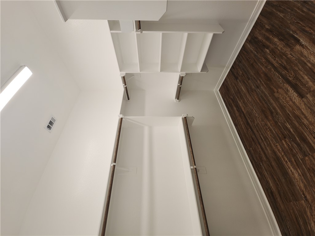 4015 Dunlap Loop College Station, TX 77845 - Photo 16 of 40 a view of a room with an empty space and wooden floor