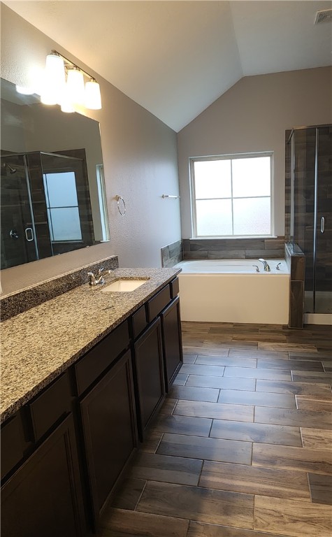 4015 Dunlap Loop College Station, TX 77845 - Photo 18 of 40 a bathroom with a granite countertop bathtub sink and mirror