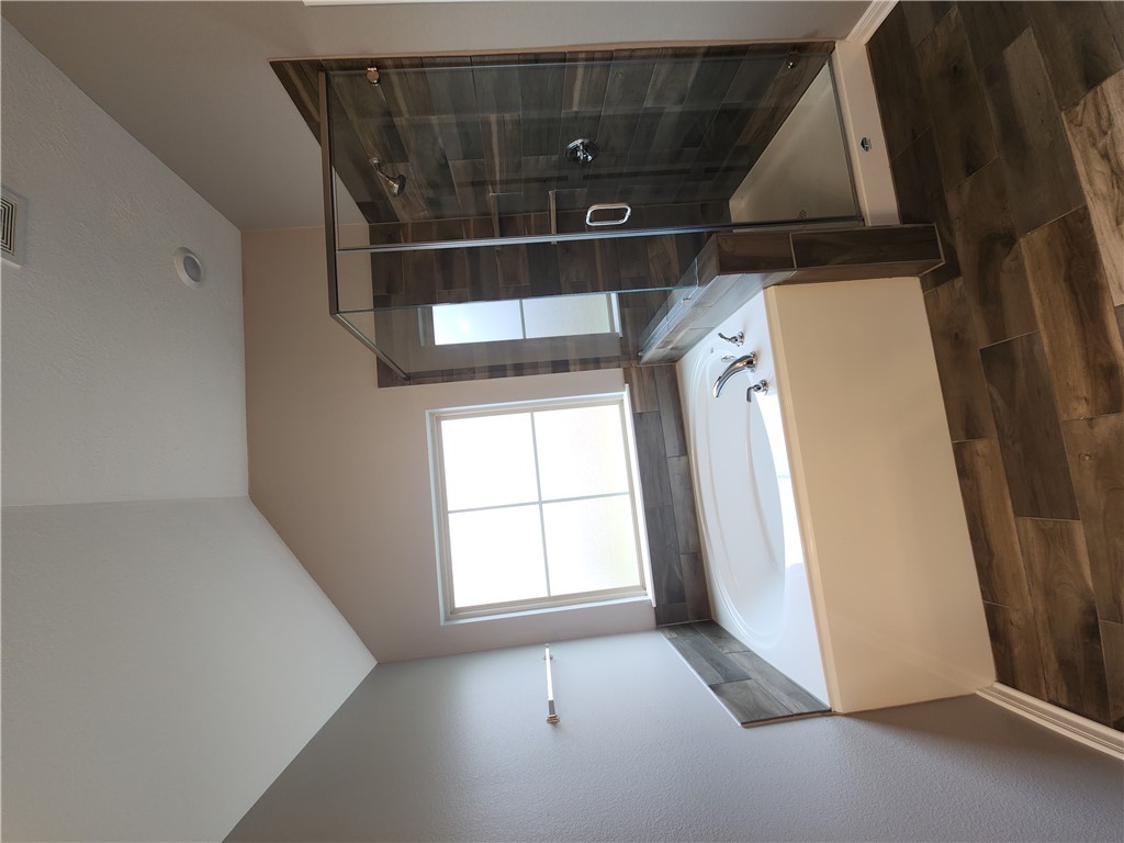 4015 Dunlap Loop College Station, TX 77845 - Photo 20 of 40 a bathroom with a bathtub and a shower