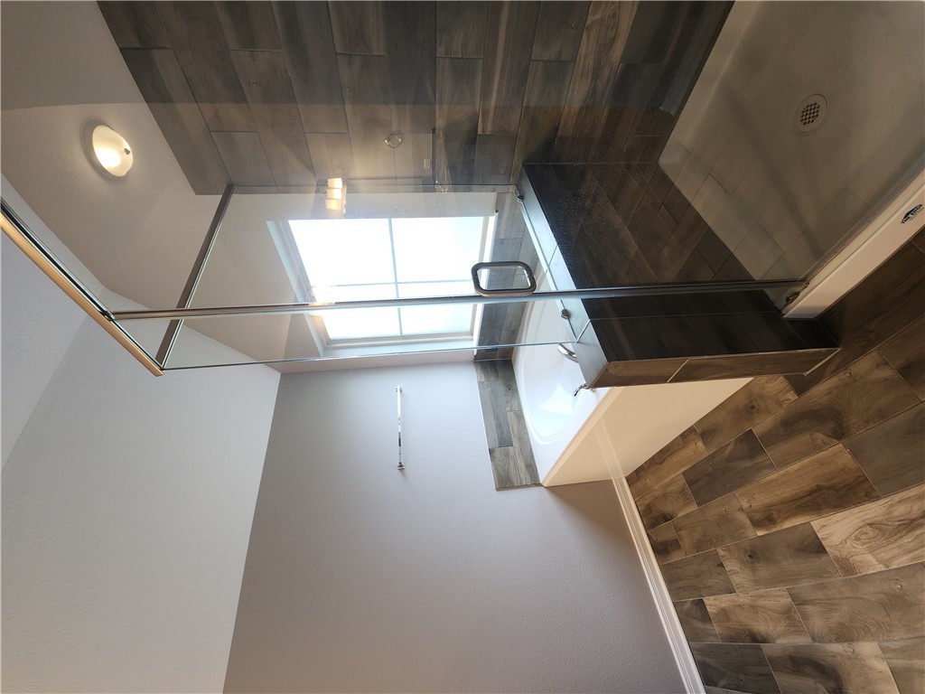 4015 Dunlap Loop College Station, TX 77845 - Photo 22 of 40 a bathroom with a granite countertop sink a toilet and bathtub