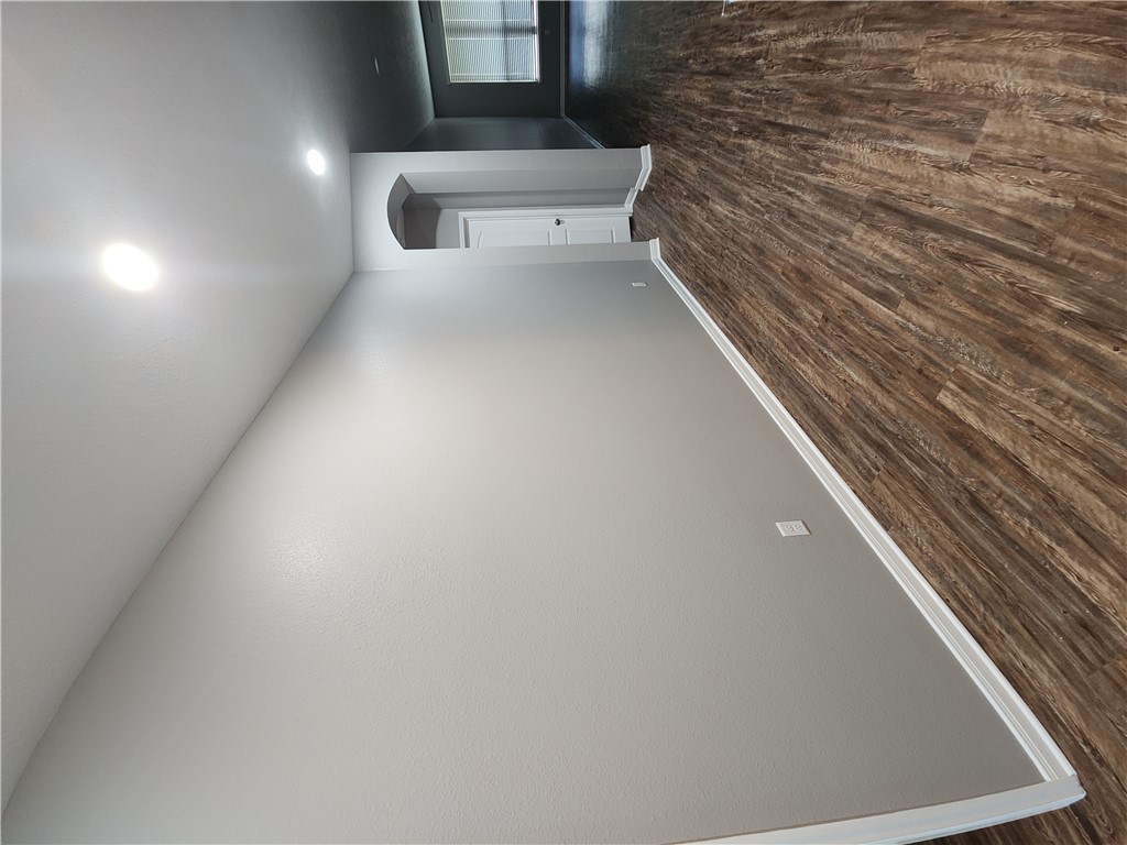 4015 Dunlap Loop College Station, TX 77845 - Photo 26 of 40 an empty room with wooden floor and windows