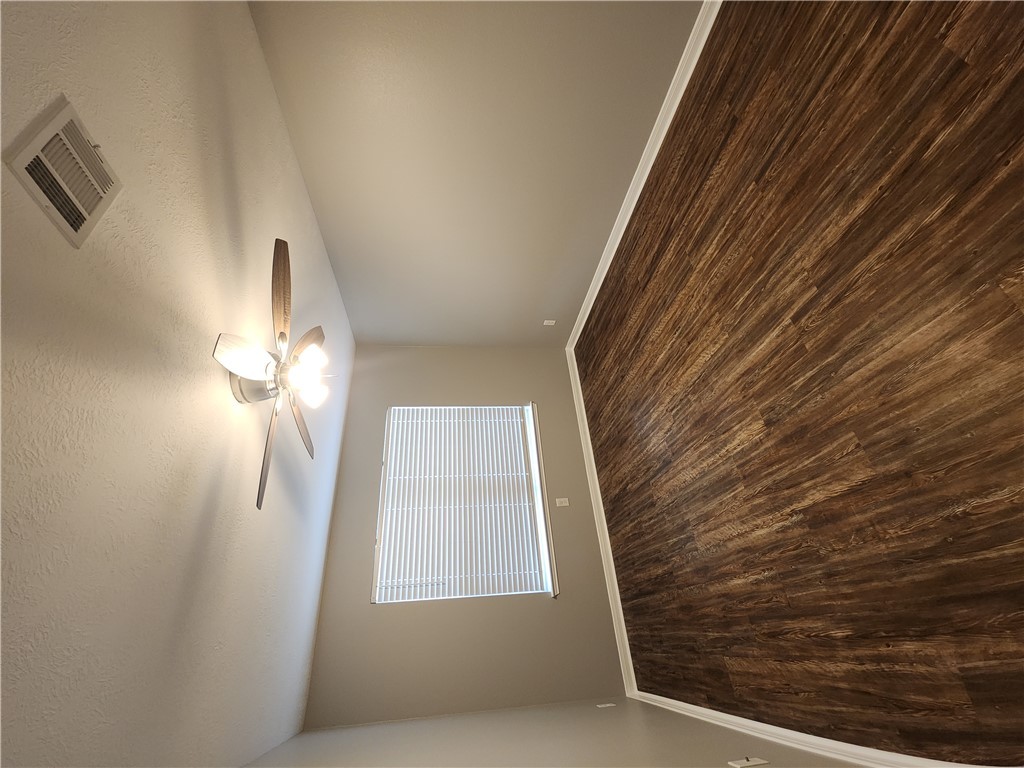 4015 Dunlap Loop College Station, TX 77845 - Photo 30 of 40 a view of empty room with wooden floor and fan