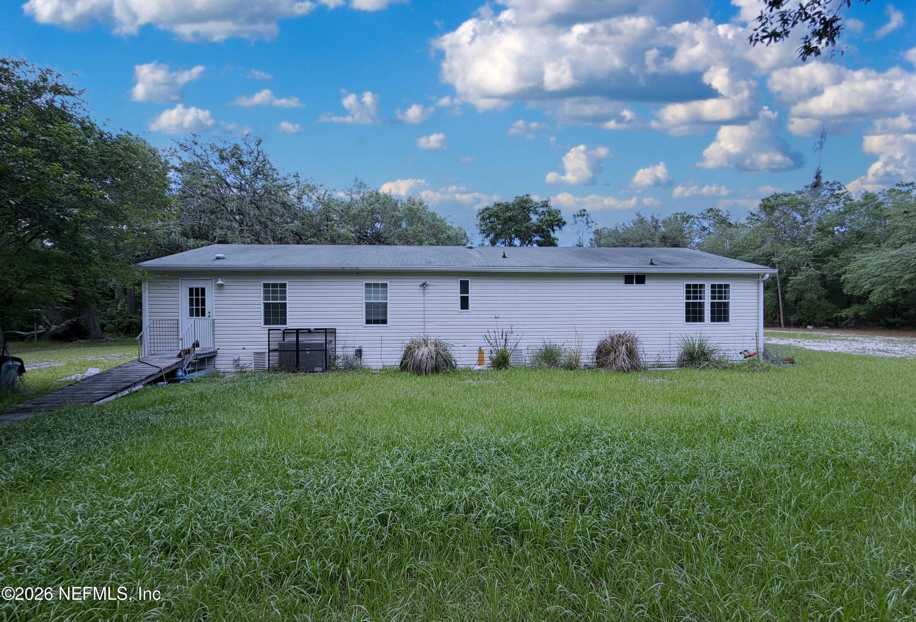 136 Short Pine Road Hawthorne, FL 32640 - Photo 4 of 39 a view of a house with backyard and garden
