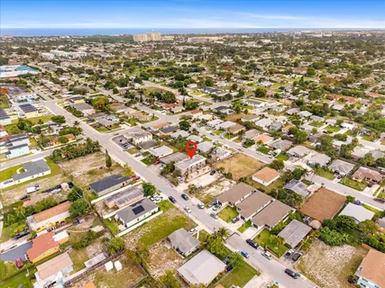 an aerial view of residential houses with outdoor space