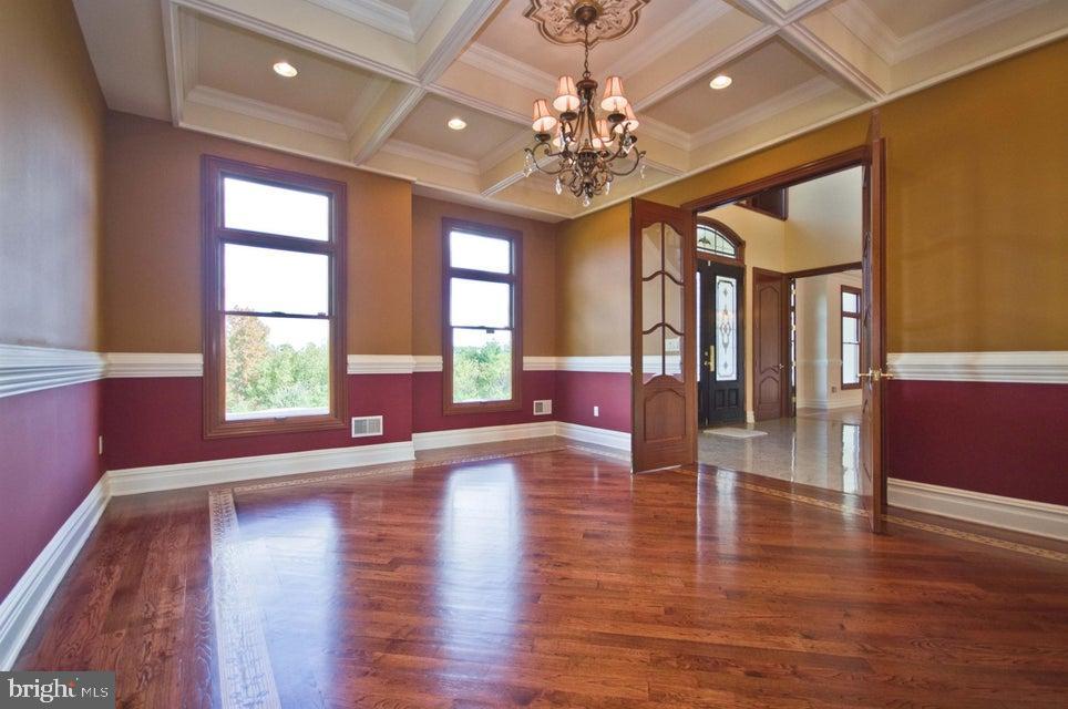 79 Potts Road Robbinsville, NJ 08691 - Photo 15 of 20 a view of an entryway with wooden floors door windows and a chandelier