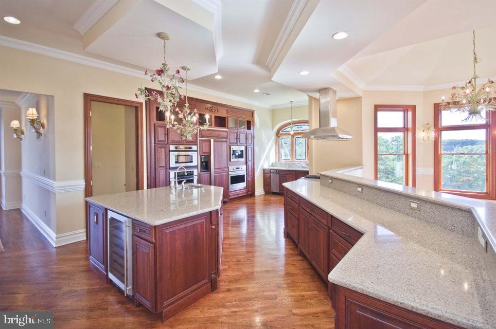 79 Potts Road Robbinsville, NJ 08691 - Photo 20 of 20 a large kitchen with kitchen island granite countertop a large island in the center and stainless steel appliances