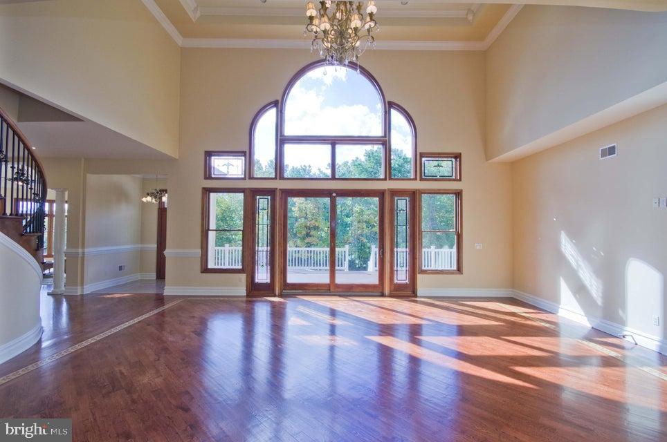 79 Potts Road Robbinsville, NJ 08691 - Photo 4 of 20 a view of empty room with wooden floor and fan