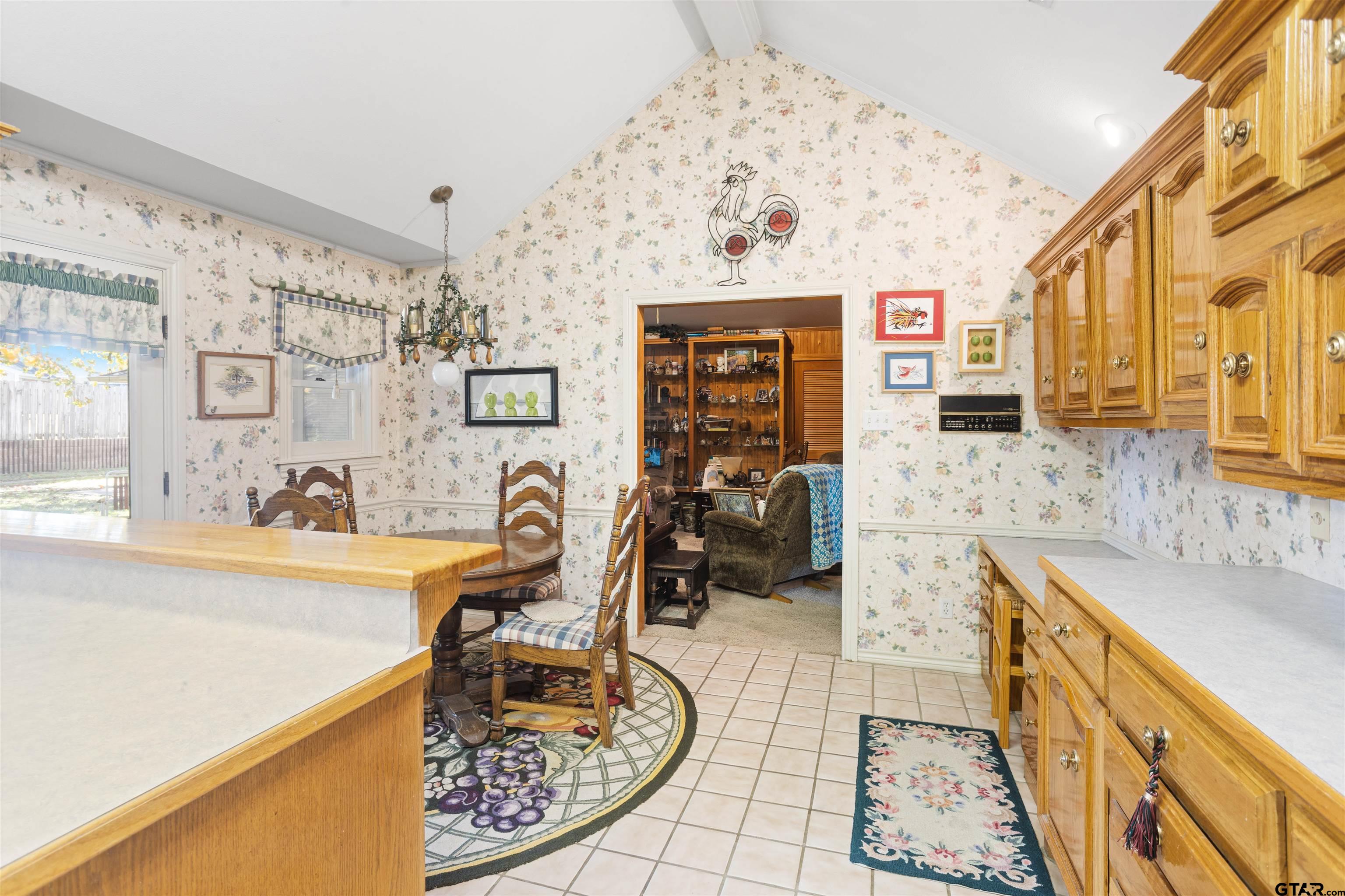 1701 Tall Timber Drive Flint, TX 75762 - Photo 15 of 40 a view of a kitchen with granite countertop a sink and a wooden floor