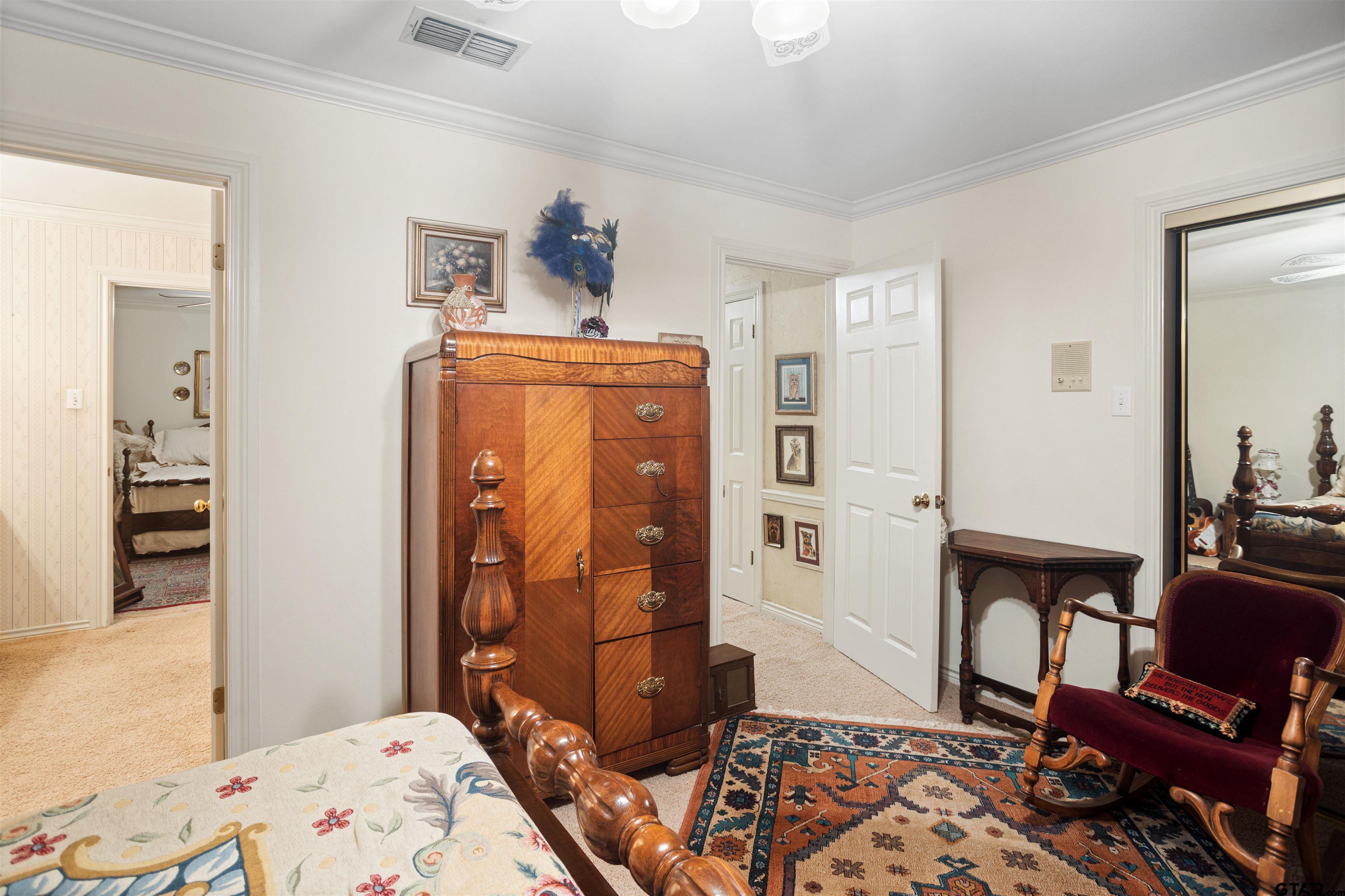 1701 Tall Timber Drive Flint, TX 75762 - Photo 20 of 40 a bedroom with a bed and wooden floor