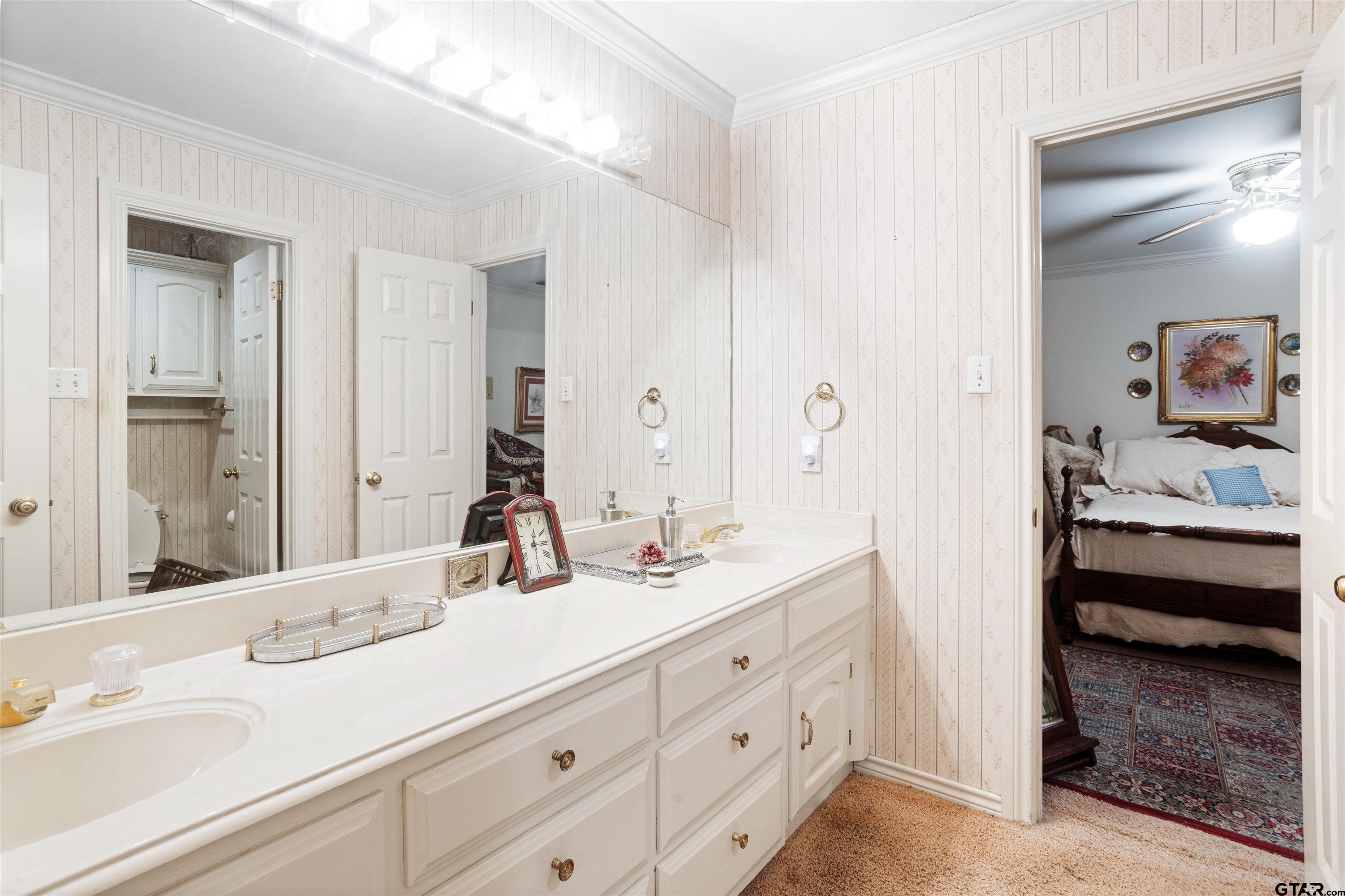 1701 Tall Timber Drive Flint, TX 75762 - Photo 21 of 40 a bathroom with a sink and a mirror