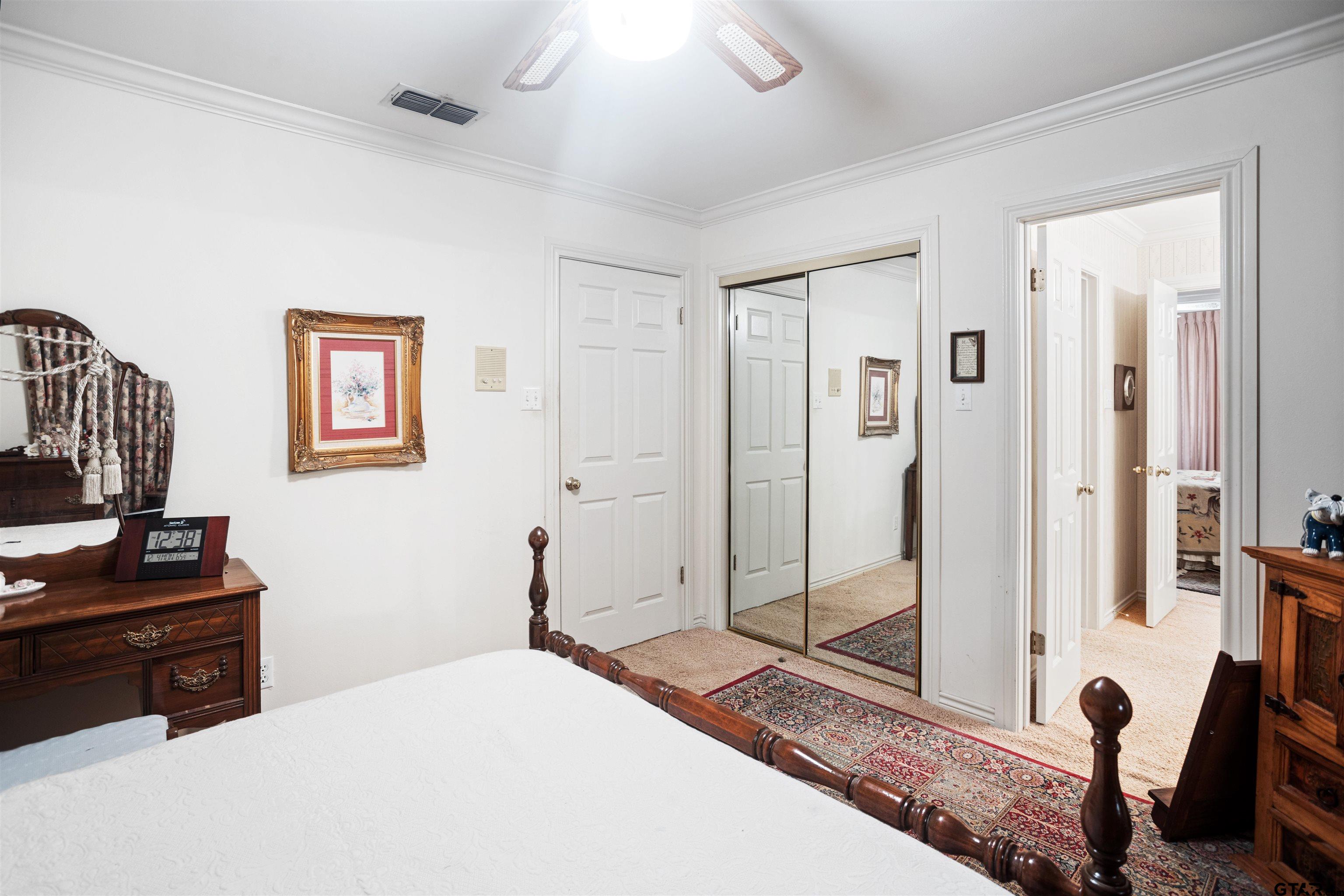 1701 Tall Timber Drive Flint, TX 75762 - Photo 23 of 40 a bedroom with a bed and a dresser