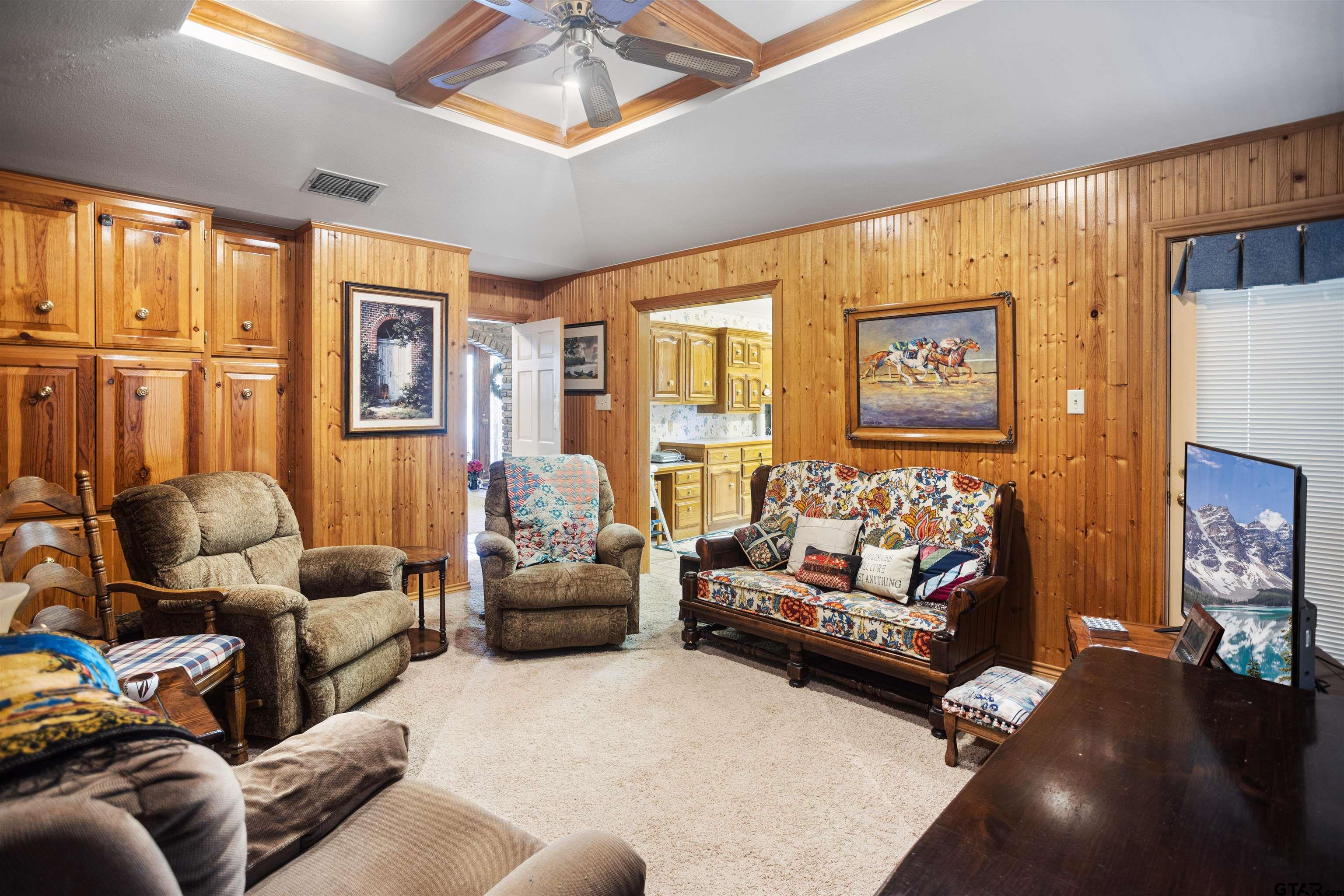 1701 Tall Timber Drive Flint, TX 75762 - Photo 6 of 40 a living room with furniture fireplace and a large window