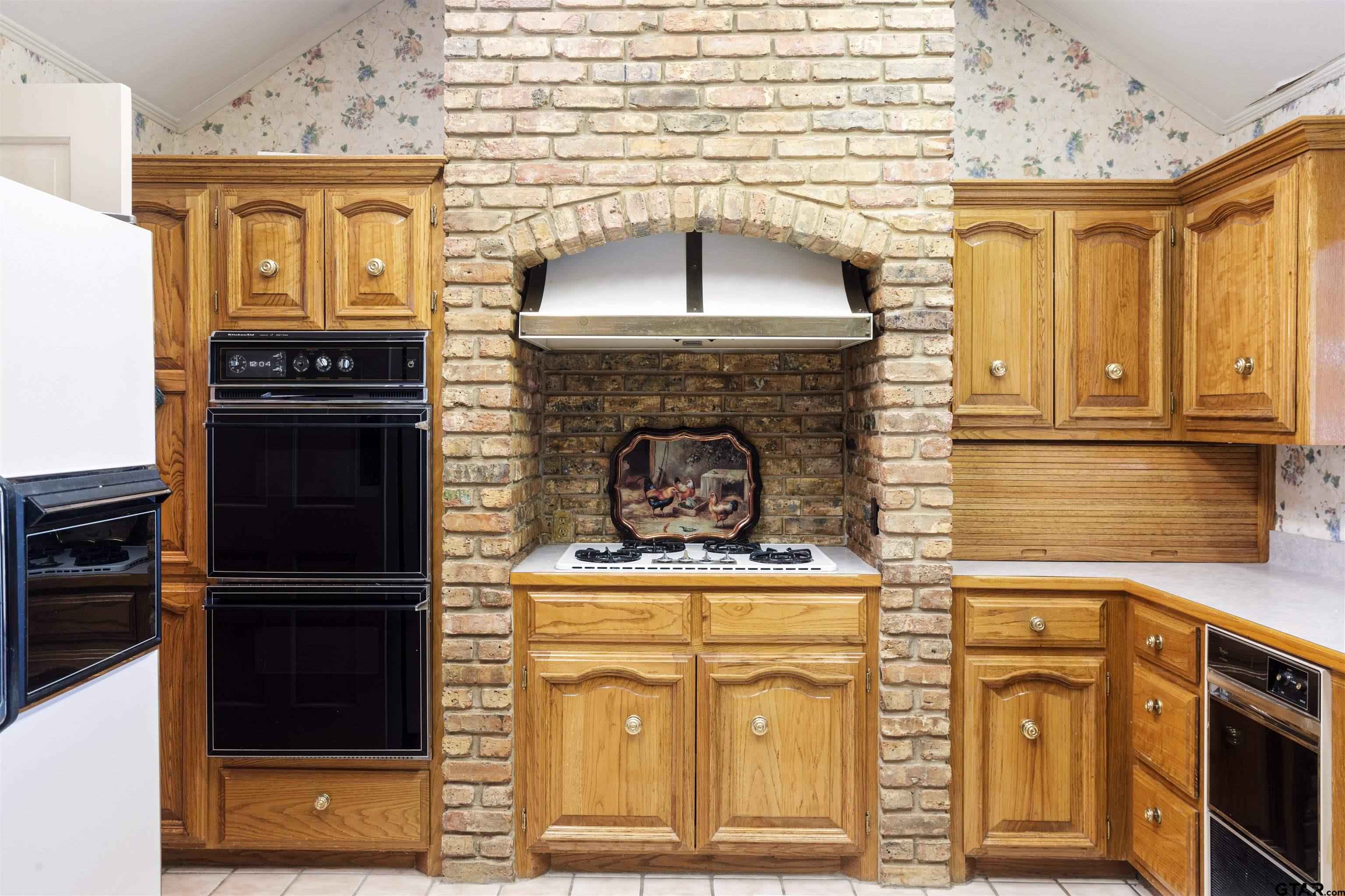 1701 Tall Timber Drive Flint, TX 75762 - Photo 8 of 40 a stove top oven sitting inside of a kitchen