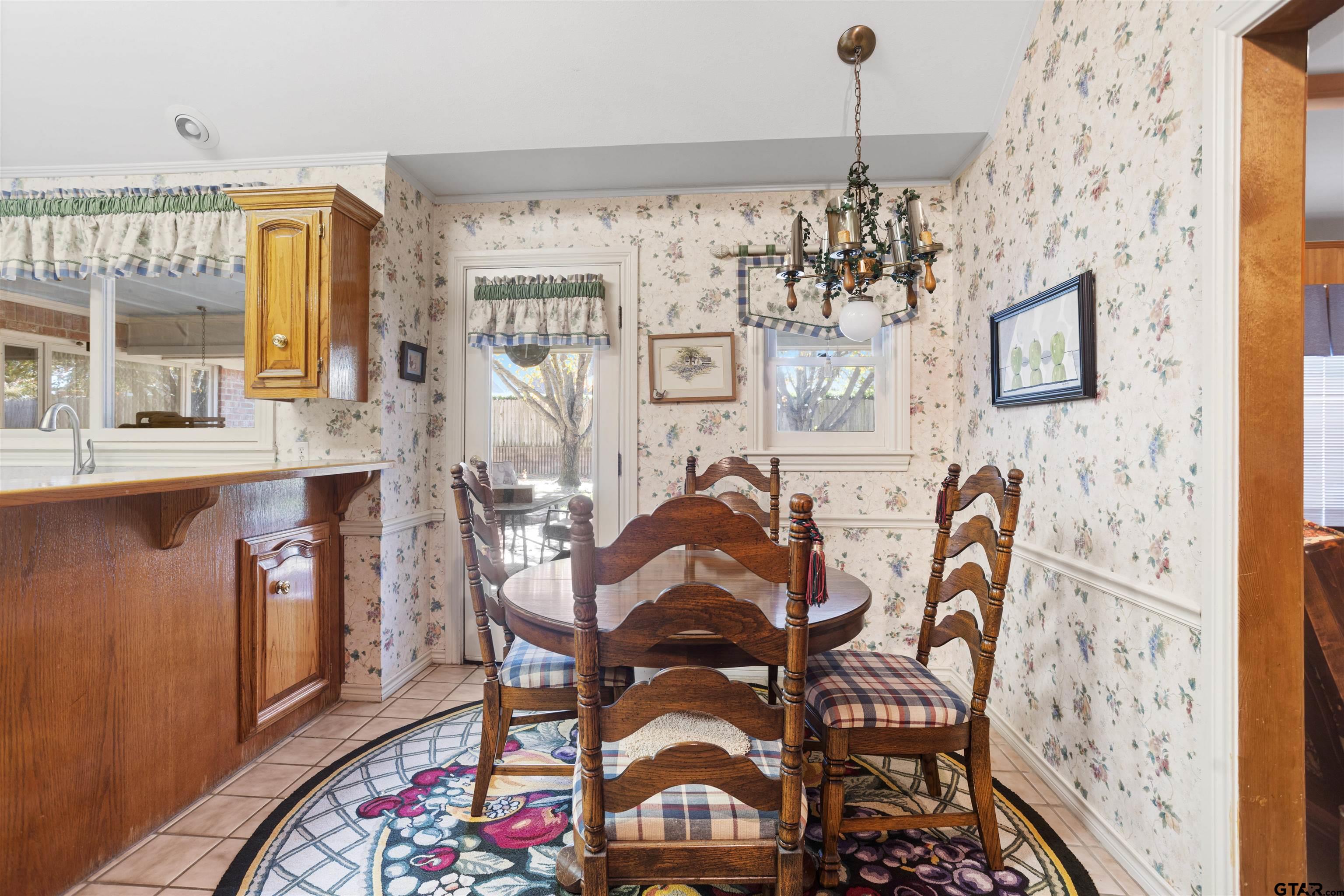 1701 Tall Timber Drive Flint, TX 75762 - Photo 10 of 40 a view of a dining room with furniture and chandelier