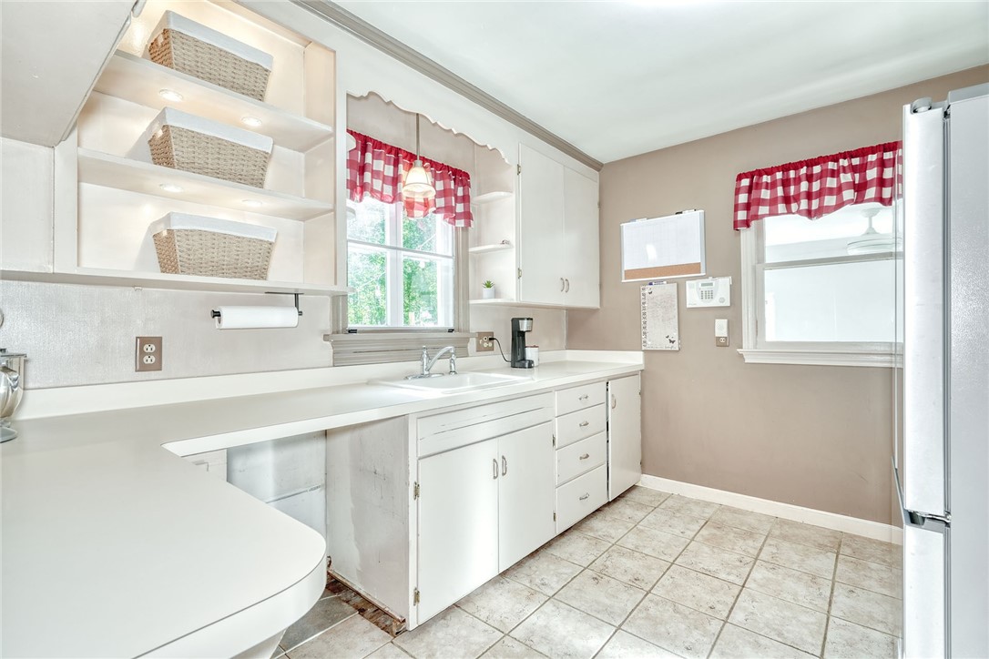 606 Bay Road Webster, NY 14580 - Photo 14 of 49 Bright neutral kitchen with sink overlooking the b