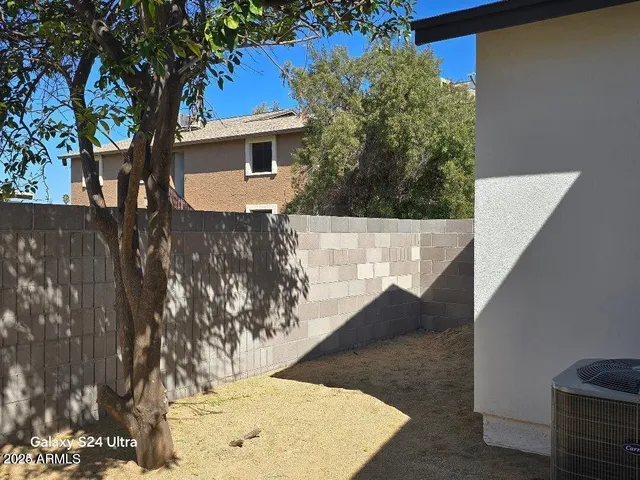 a kitchen with stainless steel appliances granite countertop white cabinets and a stove a sink