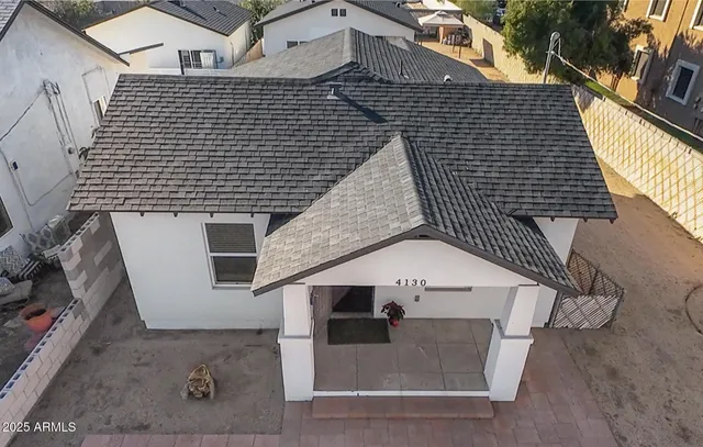 a kitchen with a refrigerator sink and cabinets