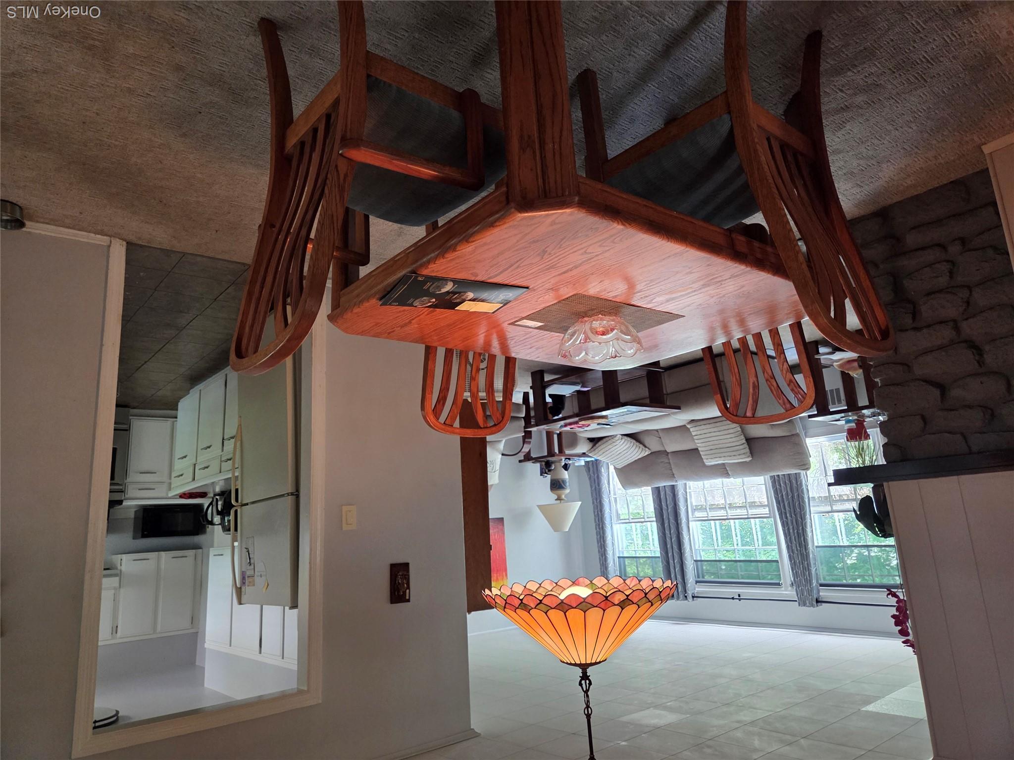342 Coldenham Road Walden, NY 12586 - Photo 15 of 20 a view of a dining room with furniture and a chandelier