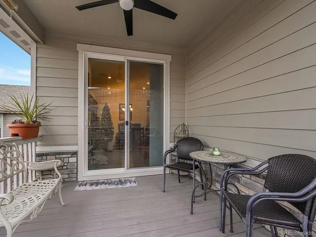a patio with table and chairs