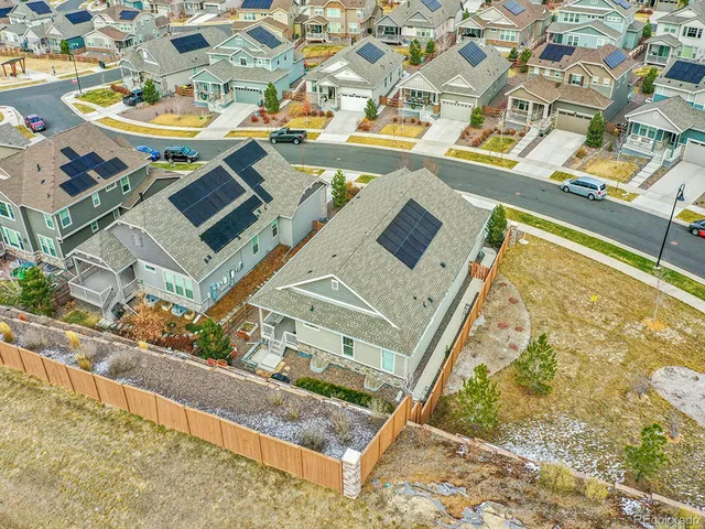 an aerial view of a house with a swimming pool