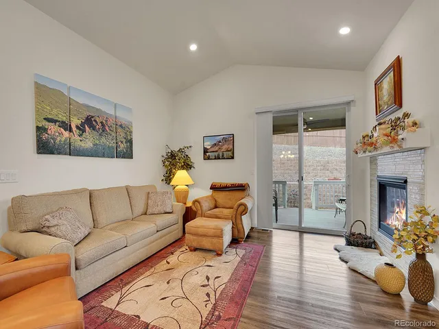 a living room with furniture or couch and a fireplace