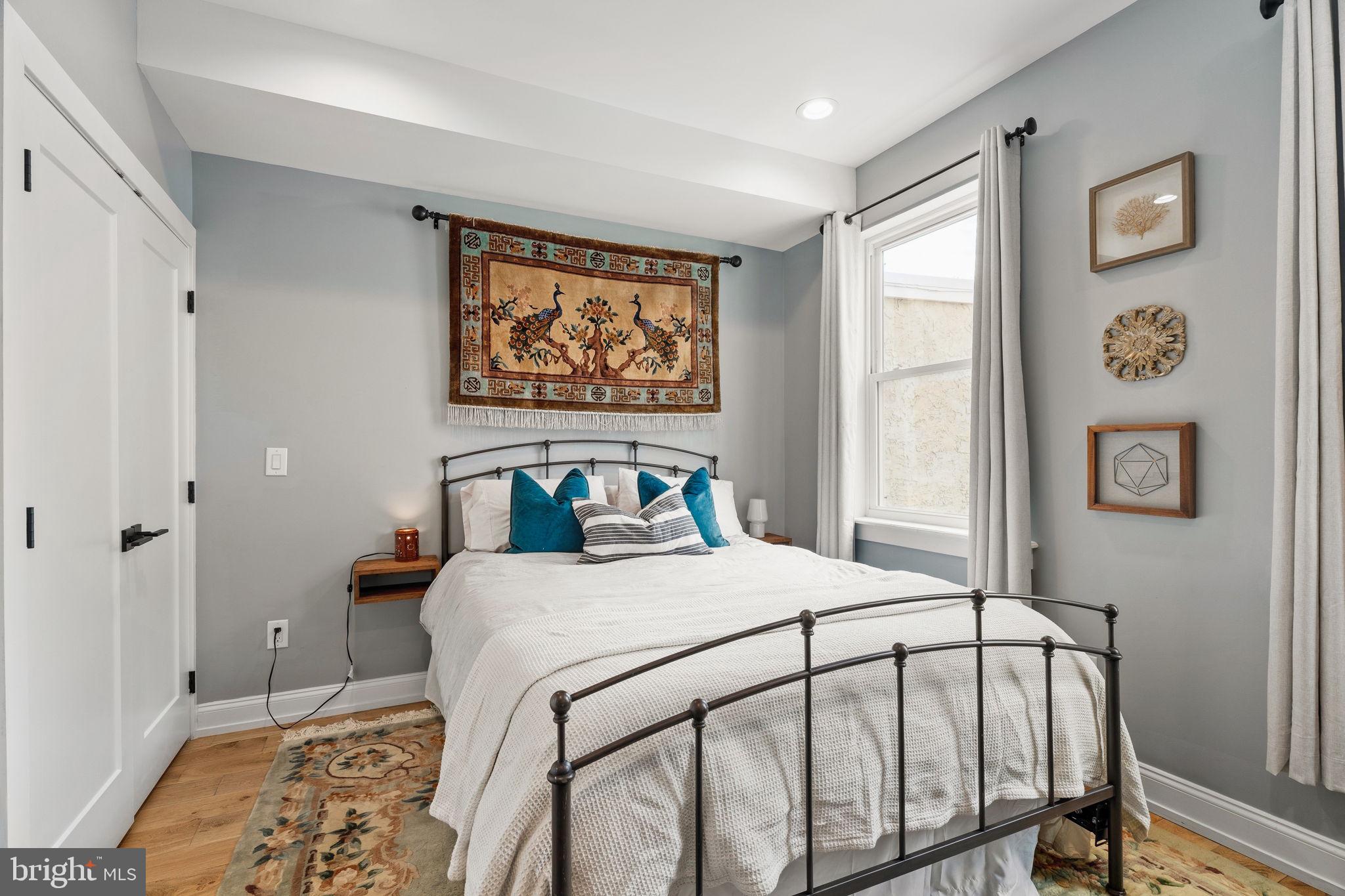 2932 Nicholas Street Philadelphia, PA 19121 - Photo 21 of 65 a bedroom with a bed and a window