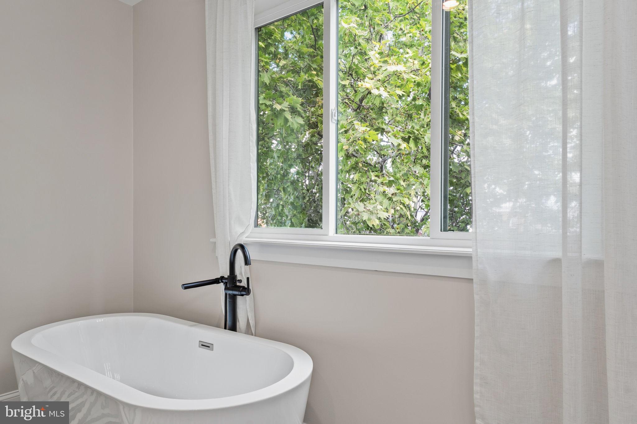 2932 Nicholas Street Philadelphia, PA 19121 - Photo 38 of 65 a bathroom with a sink and a window