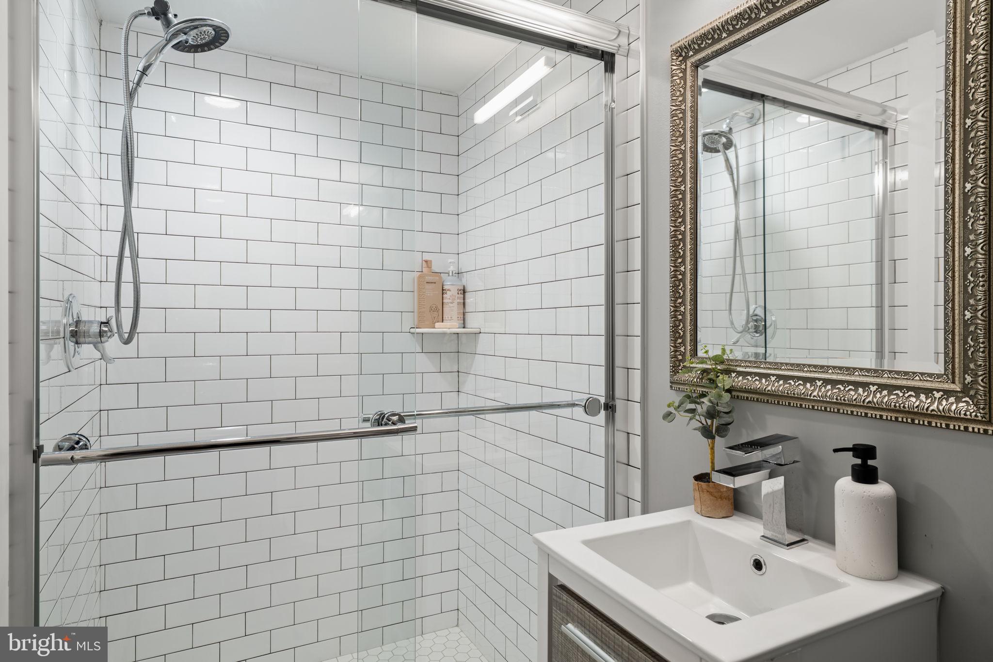 2932 Nicholas Street Philadelphia, PA 19121 - Photo 57 of 65 a bathroom with a sink a toilet and shower