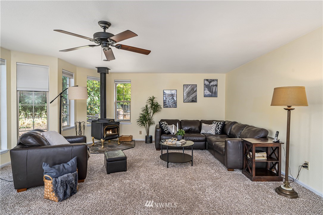 18003 Rhodes Lake Road East Bonney Lake, WA 98391 - Photo 2 of 40 a living room with furniture and a large window